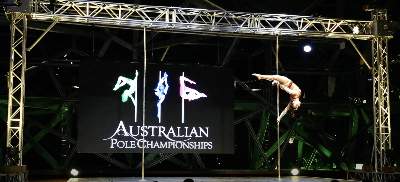 video image of woman performing on stage at Australian Pole Dance Championships