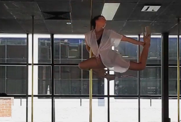 image of video pole dancing at The Pole Room CBD studio wearing heels and white shirt