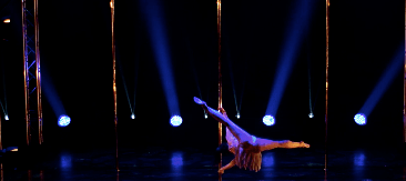video image of woman performing on stage at Survivor Amateur Pole Championships Victoria